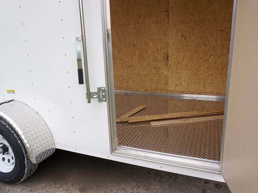 6' X 12' White Enclosed V-Nose Trailer with Diamond Plate Floor Storage - Image 2